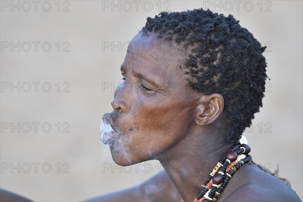 Old San woman smoking