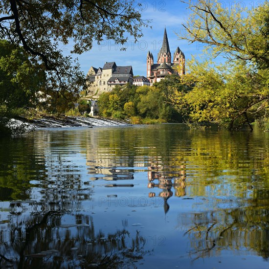 Limburg Cathedral St. Georg or Georgsdom and imburg castle over the river Lahn in autumn