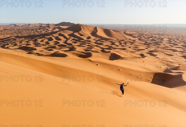 Woman running downhill