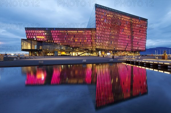 Illuminated Harpa Concert Hall at dusk