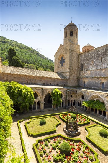 Cloister and well at the Abbaye Sainte-Marie de Fontfroide or Fontfroide Abbey near Narbonne