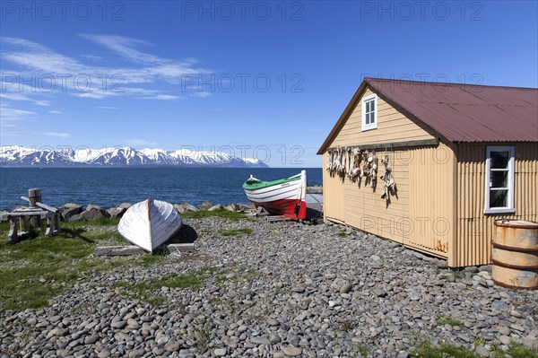 Fishing hut with boats and sea