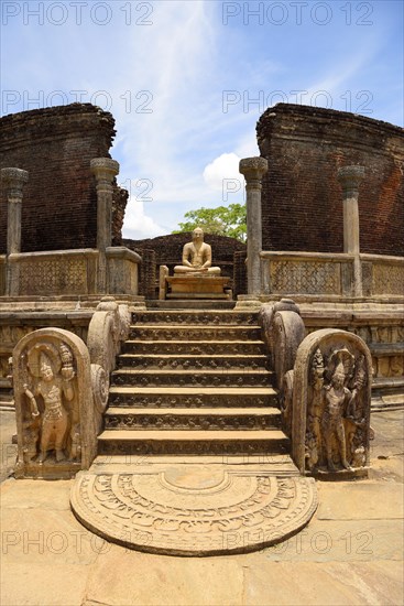 Ruin of a temple with moonstone and Buddha statue