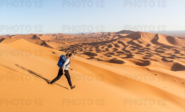 Woman running downhill