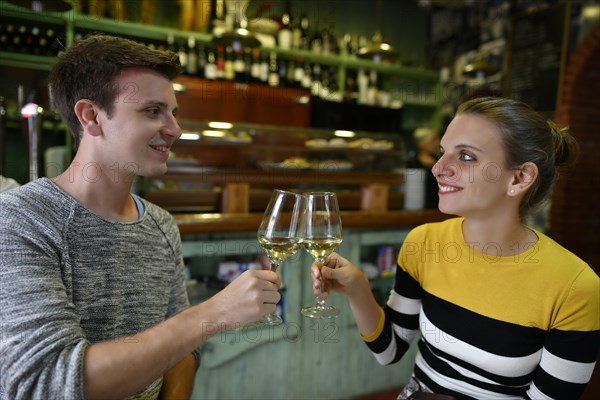 Young couple drinking wine in Tapas Bar