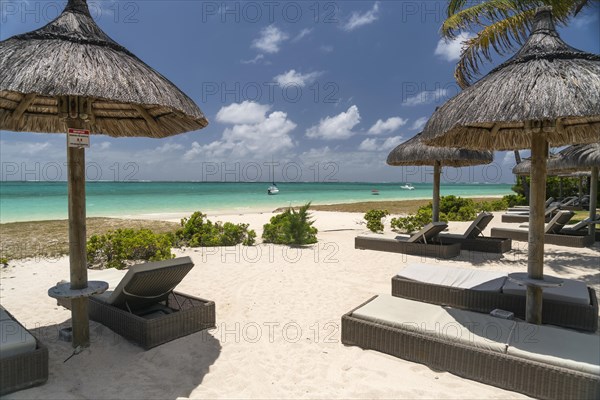 Deck chairs on the beach of Pointe d'Esny