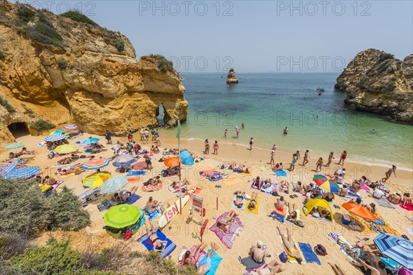 Tourists and bathers at the sandy beach