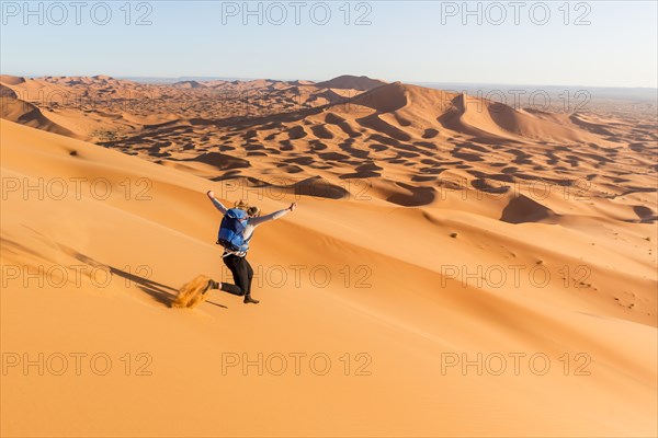 Woman running downhill