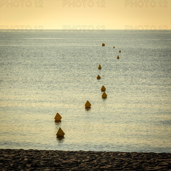 Yellow buoys in water