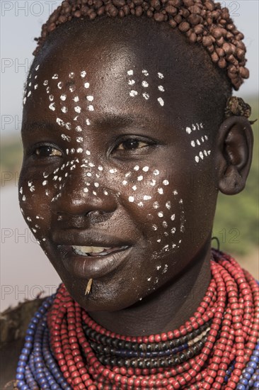 Young woman with face painting