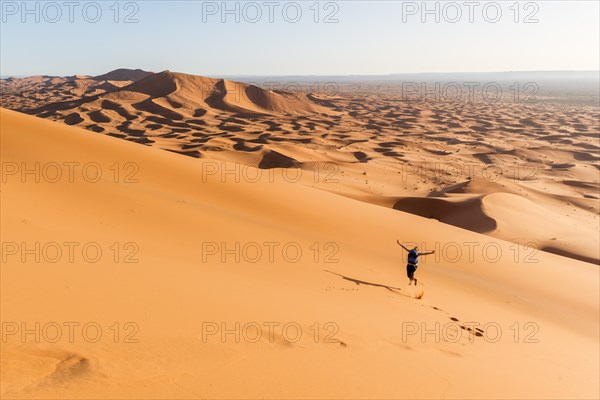 Woman running downhill