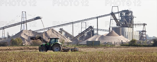 Tractor in front of gravel plant