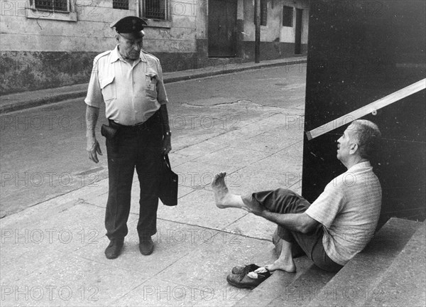 Man shows policeman his foot