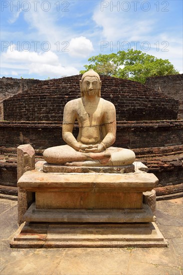 Ruin of a temple with moonstone and Buddha statue