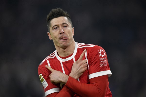 Typical celebration with crossed arms and tongue