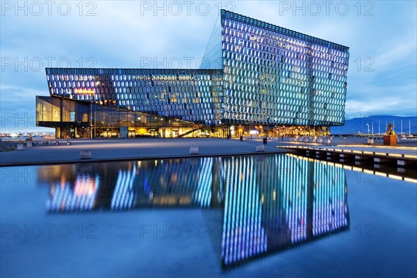 Illuminated Harpa Concert Hall at dusk