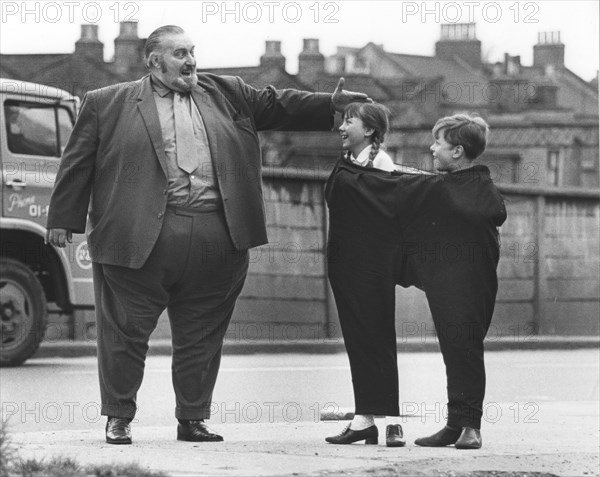 Big man with children