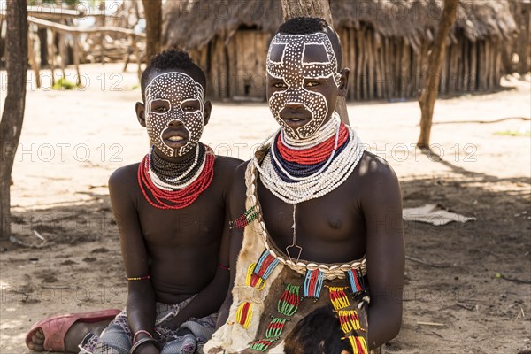 Two girls with traditional face painting