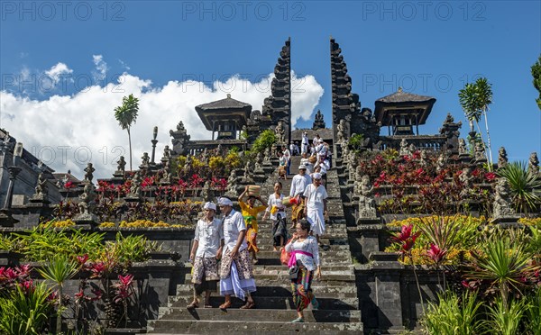 Devout Balinese descend stairs