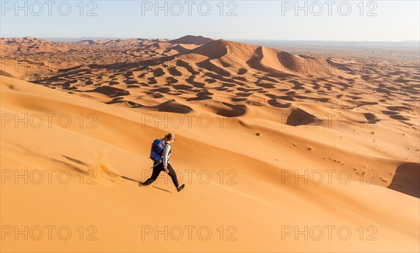 Woman running downhill
