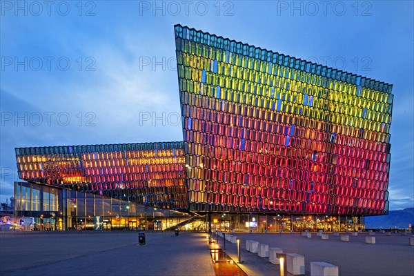 Illuminated Harpa Concert Hall at dusk