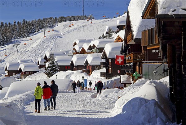 Village road with snow-covered chalets