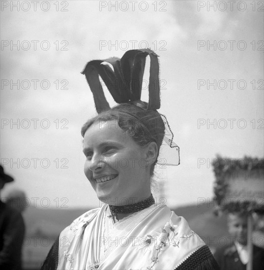 Woman in traditional traditional costume with hat