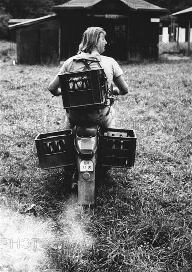 Beer crates transported by moped ca. 1970s