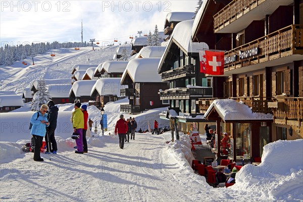 Village road with snow-covered houses