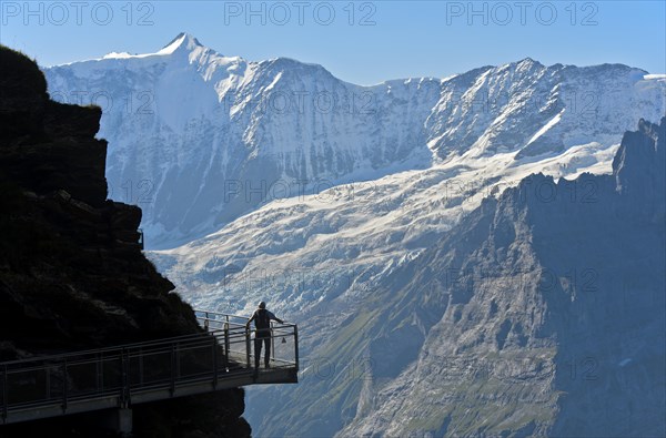 Tourist on the First Cliff Walk by Tissot in front of the Fiescherhorn north face and the Grindelwald glacier