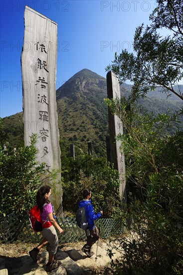 Hikers in front of wooden stelae at Wisdom Path