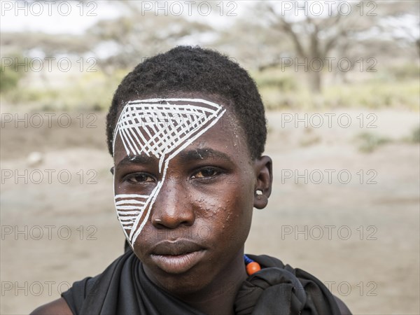 Young Massai warrior with face painting