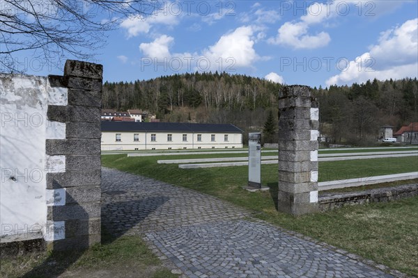 View through a camp gate to the former laundry