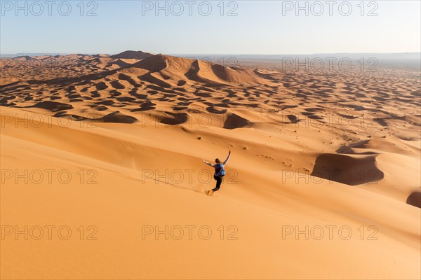 Woman running downhill