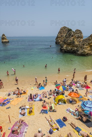 Tourists and bathers at the sandy beach