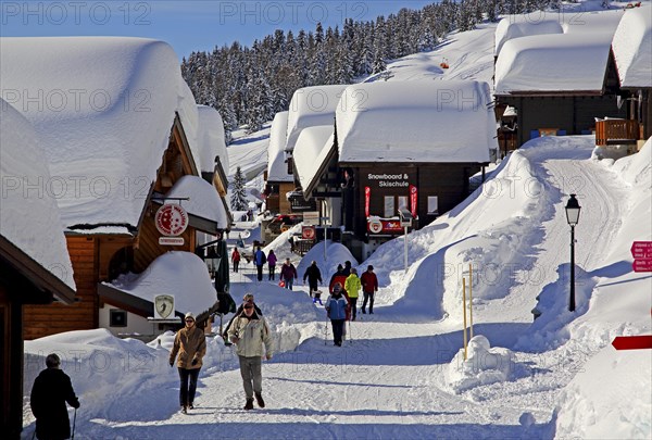 Village road with snow-covered chalets
