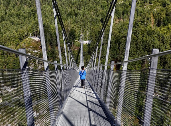 Child on suspension bridge Highline 179