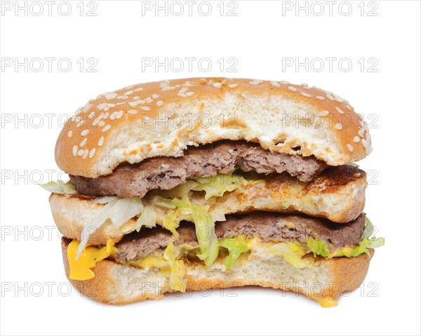 Half eaten burger against a white background
