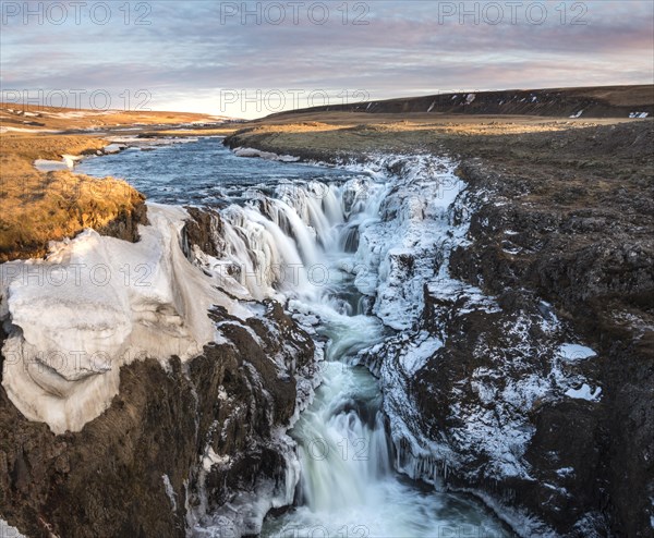 Waterfall with ice and snow in winter