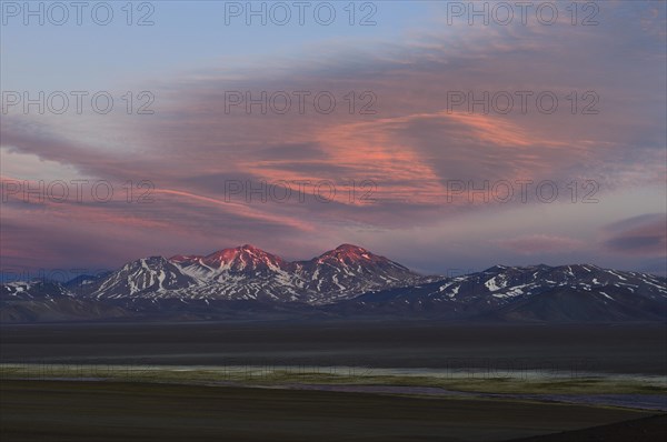 Laguna Santa Rosa with the volcano Nevado Tres Cruces at sunset