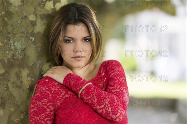 Young woman in red summer dress