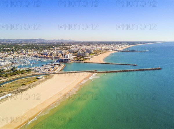 Aerial view marina and wide sandy beach