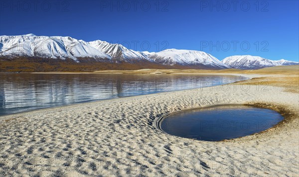 Sandy beach with pool