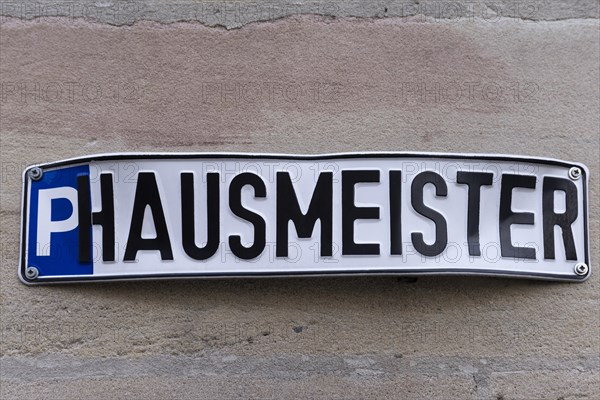 Sign on a house wall
