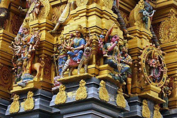 Colorful Hindu temple decorated with figures and gods