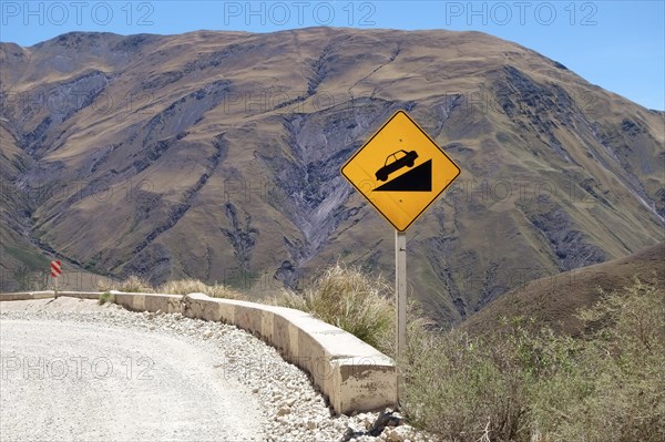 Warning sign on gravel road