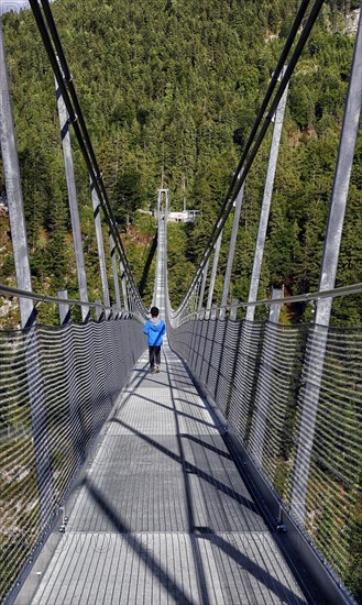Child on suspension bridge Highline 179