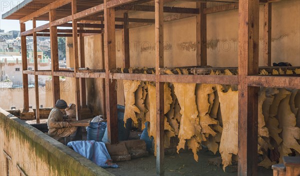 Worker working on leather