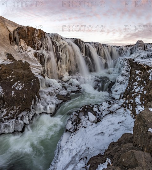 Waterfall with ice and snow in winter