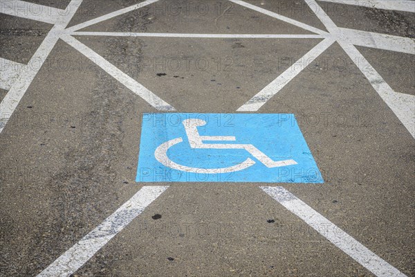 Sign for disabled parking on the ground